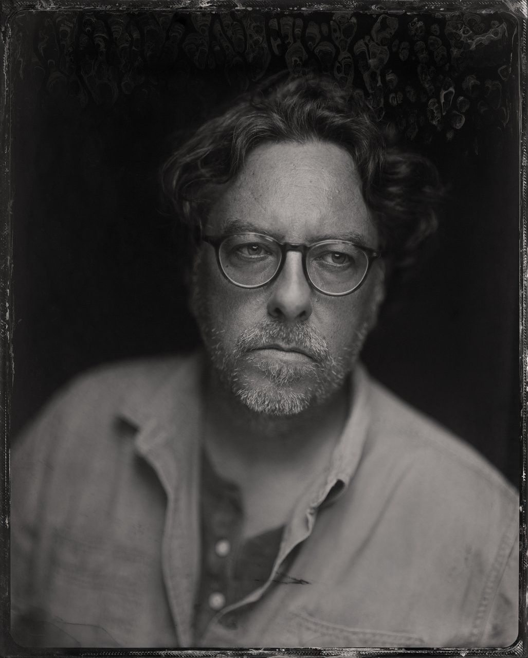 Tintype portrait of a man wearing glasses